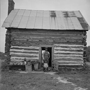 Possibly: Young sharecropper and his first child, Hillside Farm, Person County, North Carolina, 1939 Creator: Dorothea Lange