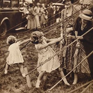 Princess Elizabeth and Princess Margaret pull their weight, 1930s (1935)