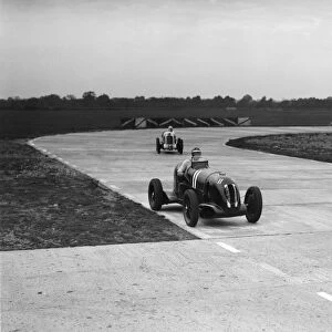 Rapier Special Racing single seater leading a MG in a race on the Campbell Circuit at Brooklands