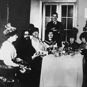 Rasputin (second from left) at the meal among His Admirers, c. 1910