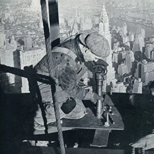 Rivetting the last bolts on The Morning Mast of the Empire State building, c1931. Artist: Lewis Wickes Hine