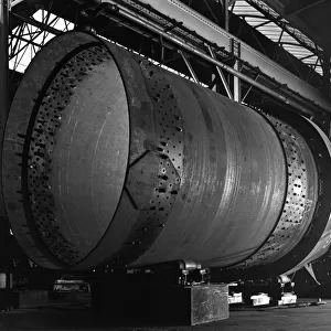 A rotary kiln section being welded in preparation for installation, Steetley, Nottinghamshire, 1962