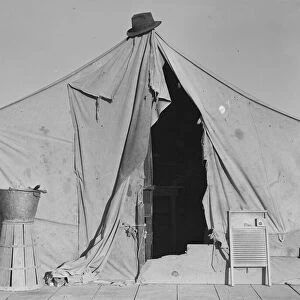 One of a row of tents, home of a pea picker, near Calipatria, Imperial Valley, California, 1939. Creator: Dorothea Lange