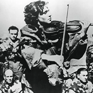 Russian army nurse playing a violin, Eastern Front, 1944