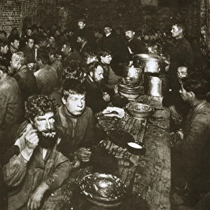 Russian manual labourers eating a meal, late 19th century