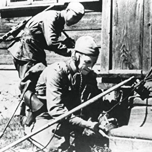 Russian soldiers with mine detectors clearing a booby-trapped house, Eastern Front, 1944