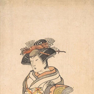 The Third Segawa Kikunojo as a Woman Standing in a Room Having a Wave-pattern Dado, ca. 1779. Creator: Shunsho