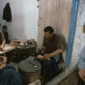 Shoemakers in a Tunisian souk