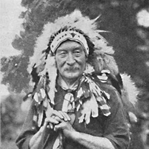 Sir Robert Baden-Powell, arrayed in the dress of a Red Indian tribe, c1925