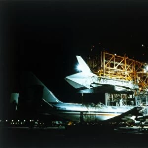 Space Shuttle and 747 carrier plane in Mate-Demate Device. Creator: NASA