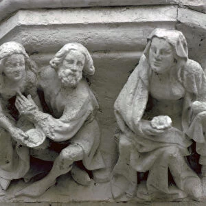Stone carving on the side of a house in Bruges