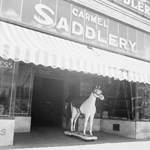 Storefront of San Joaquin Valley town, Fresno, on U. S. 99, California, 1939. Creator: Dorothea Lange