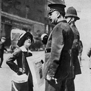 A suffragette confronting two policemen, 1913 (1937). Artist: Sport & General
