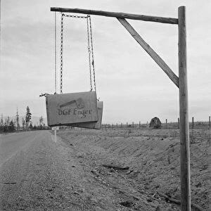Swinging mail boxes in country where snow is deep in winter, Boundary County, Idaho, 1939. Creator: Dorothea Lange