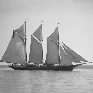 The three-mast auxiliary schooner Invincible, 1911. Creator: Kirk & Sons of Cowes The three-mast auxiliary schooner Invincible, 1911. Creator: Kirk & Sons of Cowes