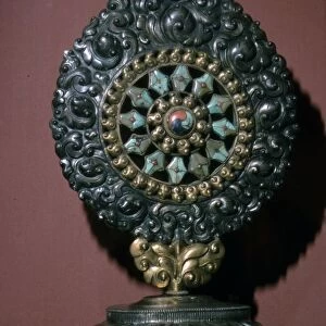 Tibetan Wheel of the Law inlaid with turquoise and coral