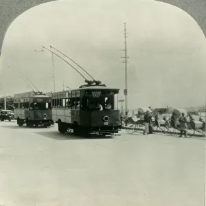 Trackless Tram Cars in Singapore, Straits Settlement, British Malaya, c1930s. Creator: Unknown