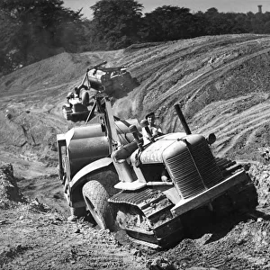 Tractor unit pulling an earth grading machine at a site near Rotherham, South Yorkshire, 1954