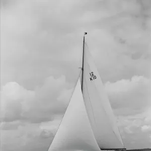 Trivia, a 12 Metre class yacht sails close-hauled, 1939. Creator: Kirk & Sons of Cowes