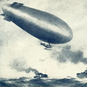 Twixt Sea and Sky. British Airship Towed by Warship, 1917. Creator: Unknown