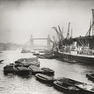 View of the busy Thames looking towards Tower Bridge, London, c1920