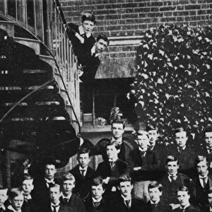 Winston climbing a staircase, while the class pose, c1889, (1945)