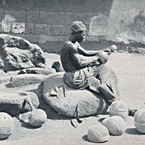 A Yoruba man engraving clay bowls and water jars, Lagos hinterland, Southern Nigeria, 1912. Artist: AW Gelston