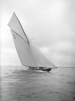 The 12 Metre sailing yacht Rollo racing upwind, 1911. Creator: Kirk & Sons of Cowes