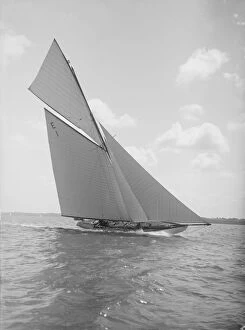 William Fife Collection: The 12 Metre yacht Alachie makes swift progress upwind, 1911. Creator: Kirk & Sons of Cowes