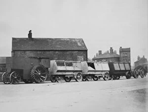 1900 Fowler armoured traction engine with munitions wagons. Creator: Unknown