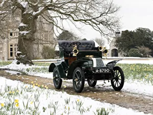 1904 De Dion Bouton model Q in snow with daffodils at Beaulieu. Creator: Unknown