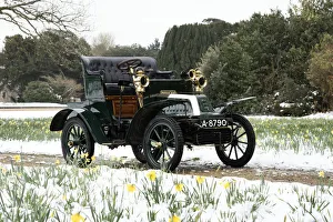 1904 De Dion Bouton model Q in snow with daffodils at Beaulieu. Creator: Unknown