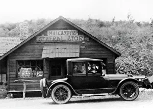 Cadillac Prints: 1916 Cadillac V8 car, parked outside a general store, USA, (c1916?)