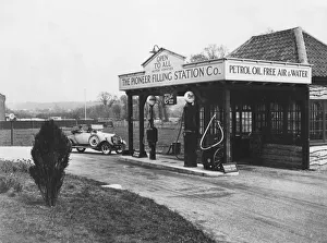 Petrol Station Prints: 1923 Calcott 10hp at petrol station. Creator: Unknown