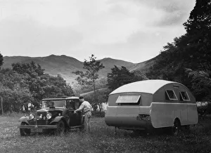 1930 Morris Oxford Six with Winchester Streamline caravan. Creator: Unknown