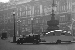 1930 Morris Oxford Six with Winchester Streamline caravan, Picadilly. Creator: Unknown