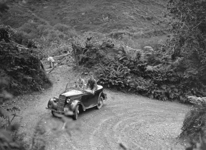 Hairpin Bend Prints: 1935 Ford Ten tourer taking part in a motoring trial, late 1930s. Artist: Bill Brunell