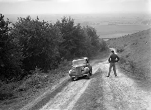 Hillman Prints: 1935 Hillman Minx 1185 cc competing in a Talbot CC trial. Artist: Bill Brunell