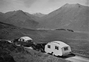 1936 Austin Twenty with caravan and 1936 Oldsmobile Eight with caravan. Creator: Unknown