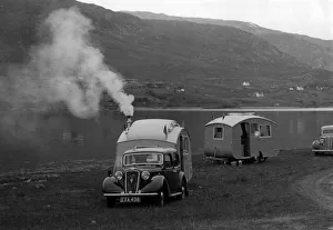 Hutchings Prints: 1937 Austin 12hp saloon with caravan. Creator: Unknown