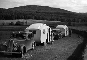 Camping Gallery: 1937 Hillman 14 towing caravan. Creator: Unknown