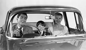 Safety Prints: 1957 Vauxhall Victor with family together in front seat. Creator: Unknown