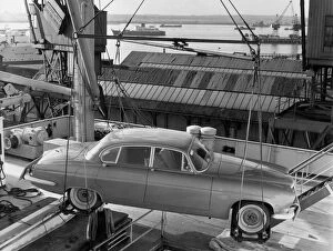 1962 Jaguar MkX being loaded on to Saxonia ship at Southampton docks for export. Creator: Unknown