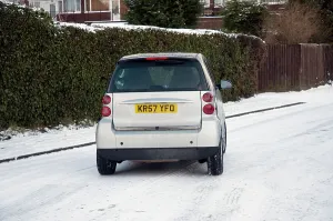 Dangerous Driving Conditions Prints: 2007 Smart car sliding on snowy road