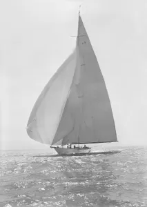 Breezy Prints: The 23 Metre Candida (K8) sailing with spinnaker, 1935. Creator: Kirk & Sons of Cowes