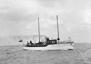 The 23 ton motor yacht Kiwi under way, 1914. Creator: Kirk & Sons of Cowes