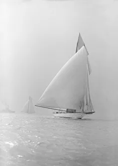 The 250 ton schooner Germania running under spinnaker, 1913. Creator: Kirk & Sons of Cowes