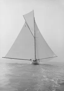 The 40-rater cutter Carina sailing full sail downwind, 1913. Creator: Kirk & Sons of Cowes The 40-rater cutter Carina sailing full sail downwind, 1913. Creator: Kirk & Sons of Cowes