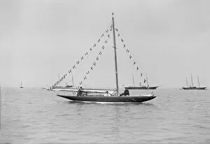 Sailboat Gallery: The 6 Metre Cremona moored with flags, 1913. Creator: Kirk & Sons of Cowes