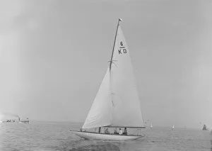 Bermuda Rig Prints: The 6 Metre Flya (K13) sailing close-hauled, 1921. Creator: Kirk & Sons of Cowes